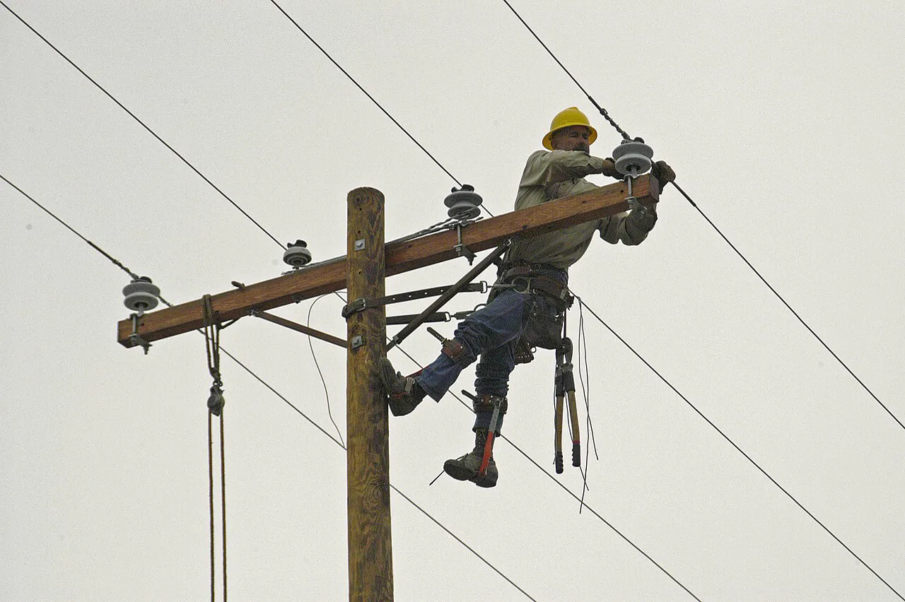Utility lineman making an emergency power line repair