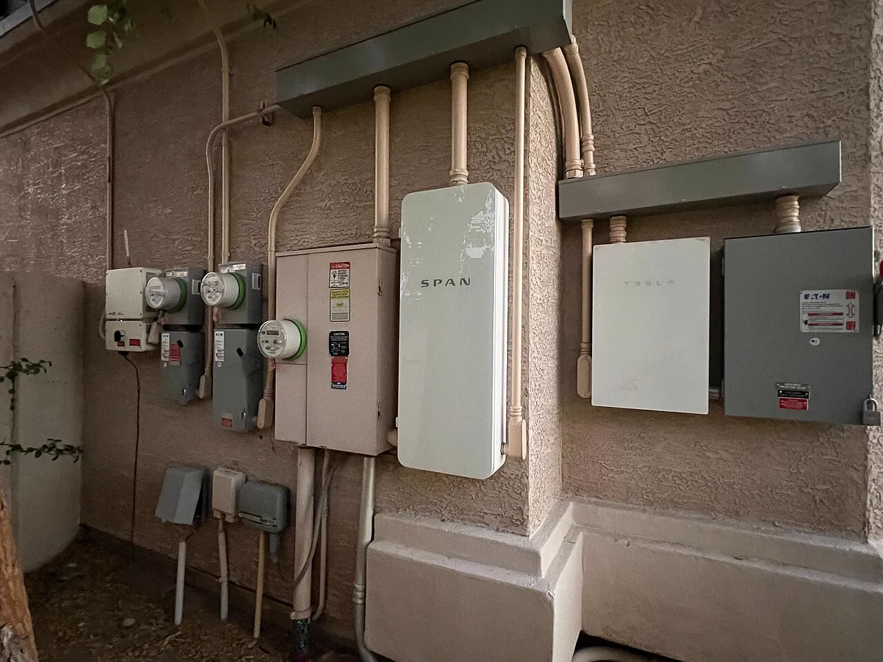 Modern electrical panel and meter bank on a home's service entrance